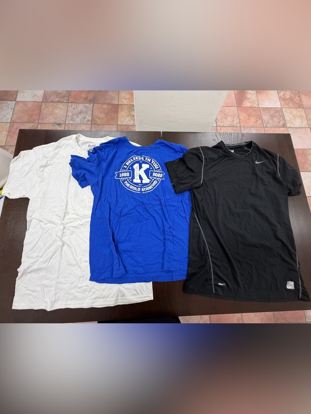 Three size large tee shirts